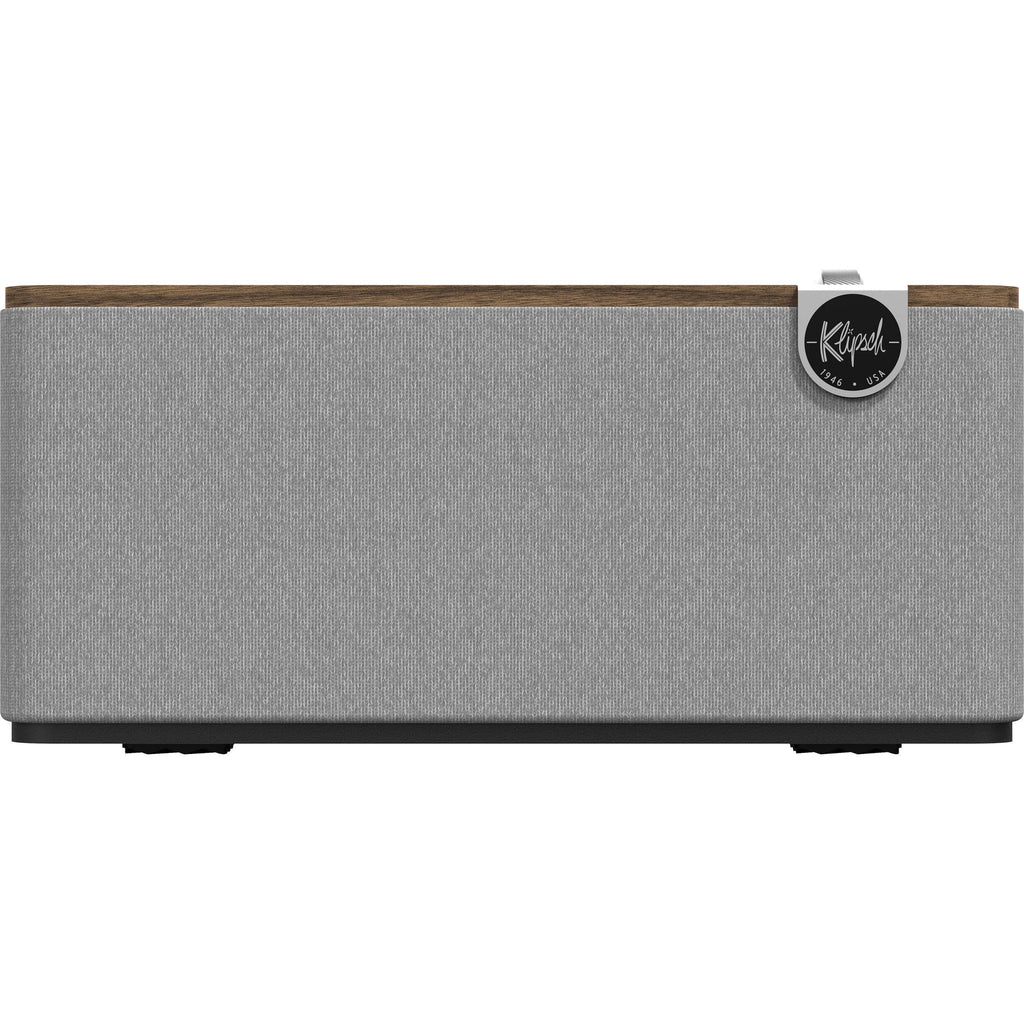 Klipsch The One Plus wireless speaker with wooden finish and control knobs, compact and stylish.