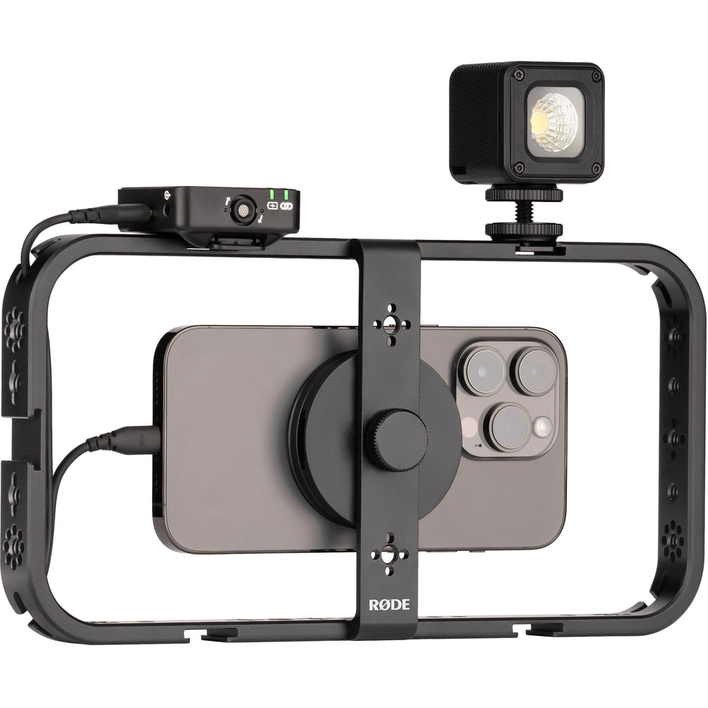 Rode Phone Cage mounted on a tripod for smartphone video recording with adjustable support and grip.