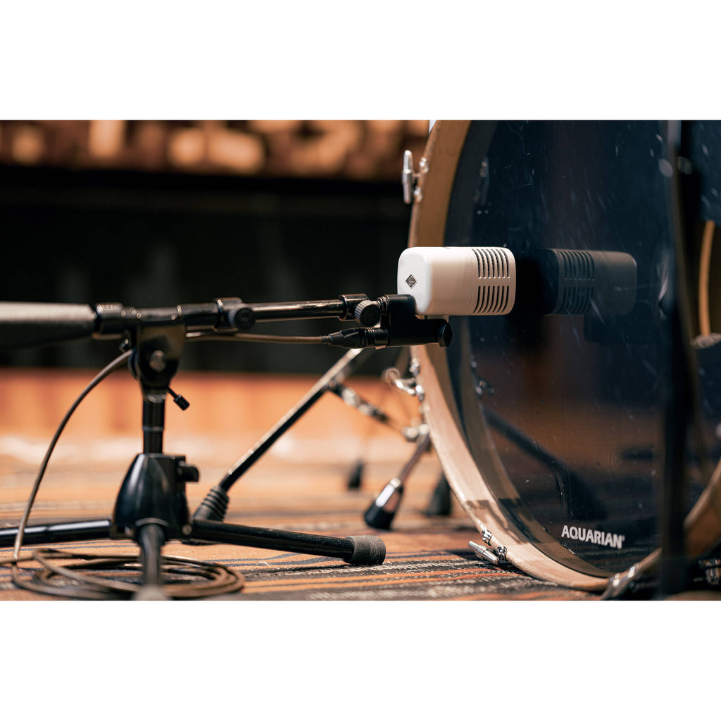 Universal Audio SD-5 dynamic microphone shown with black grille and body, ideal for professional audio recording and live performance.