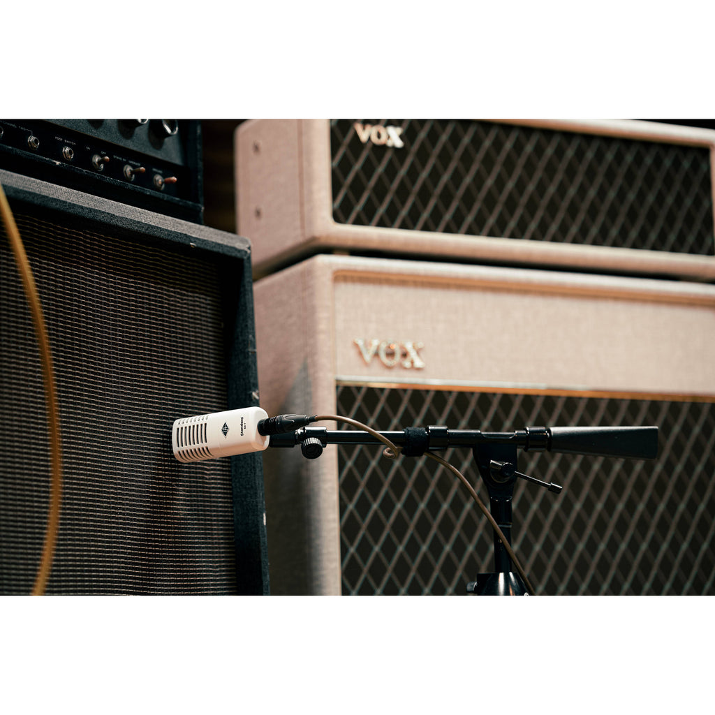Universal Audio SD-7 dynamic microphone shown with black grille and robust body, ideal for professional audio recording.