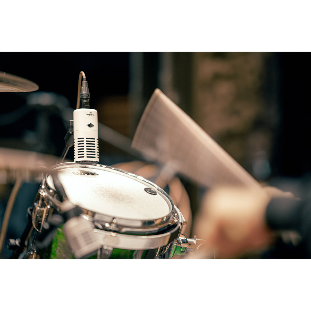 Universal Audio SD-7 dynamic microphone with a rugged metal body and grille, ideal for studio and live sound applications.