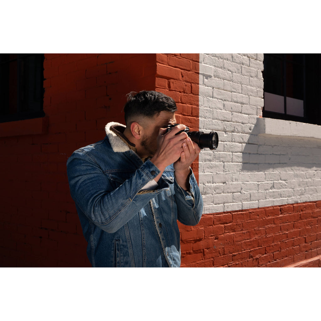 Panasonic Lumix GH7 mirrorless camera with 12-60mm F/2.8-4 lens, ready for high-quality video and photography.