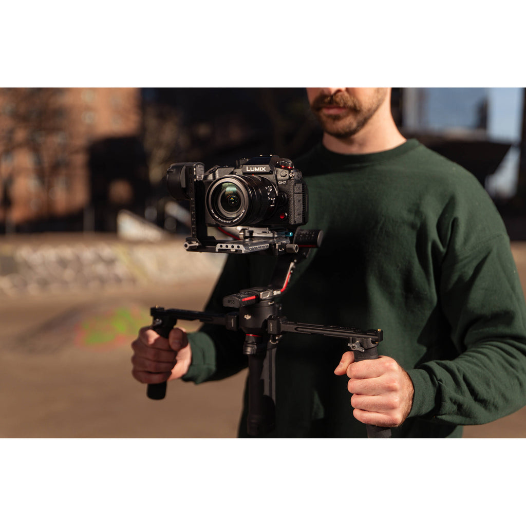 Panasonic Lumix GH7 video camera with 12-60mm f/2.8-4 lens, showing the camera body and attached lens on a white background.