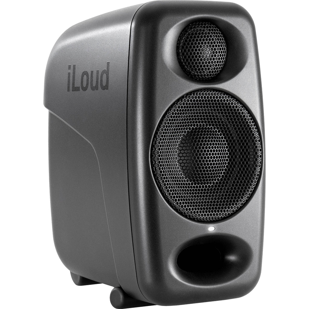 IK Multimedia iLoud Micro Monitor Pro active nearfield monitors on a desk, showing compact speakers with control knobs.