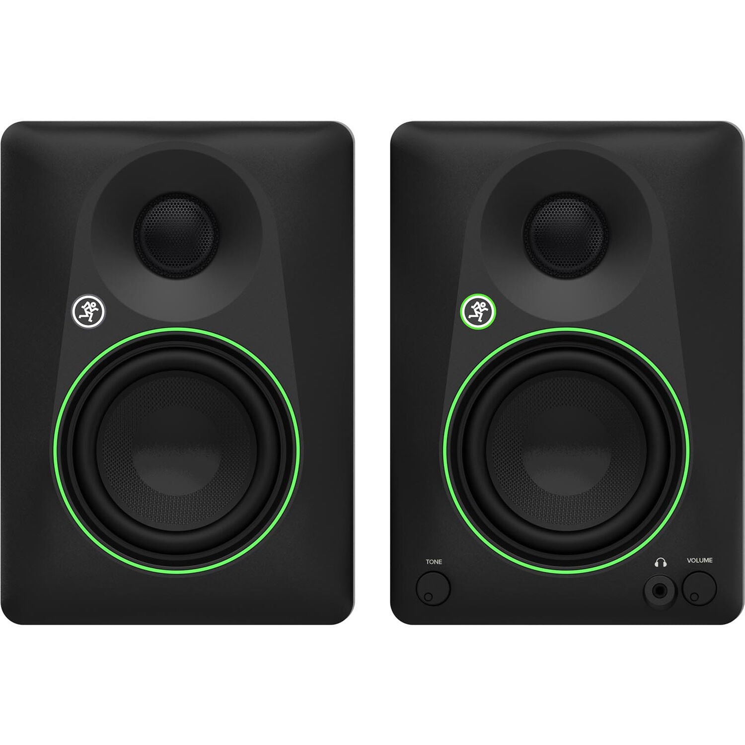 Mackie CR4.5 desktop speakers on a desk with audio equipment, showcasing the compact design and control knobs.