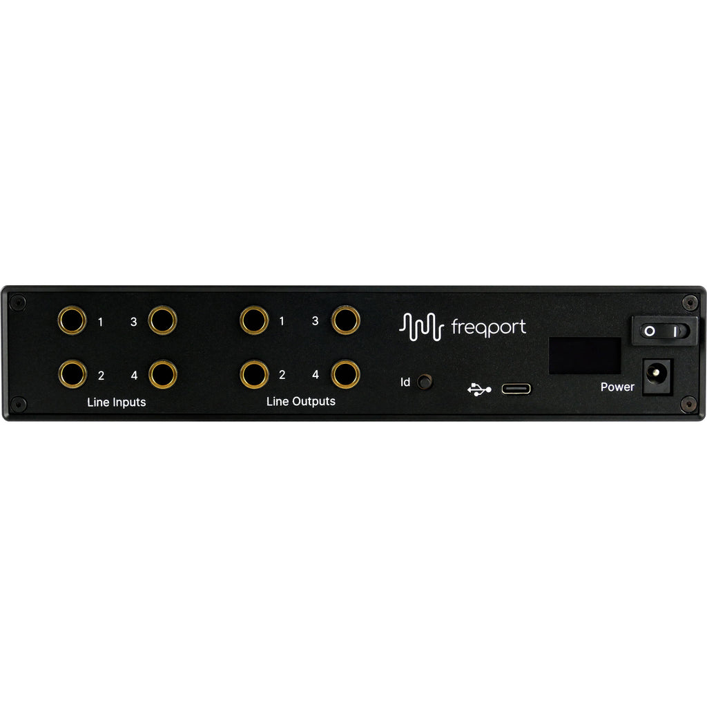 Freqport FreqInOut FO1 audio interface with input and output ports, compact design, and professional audio connectivity.