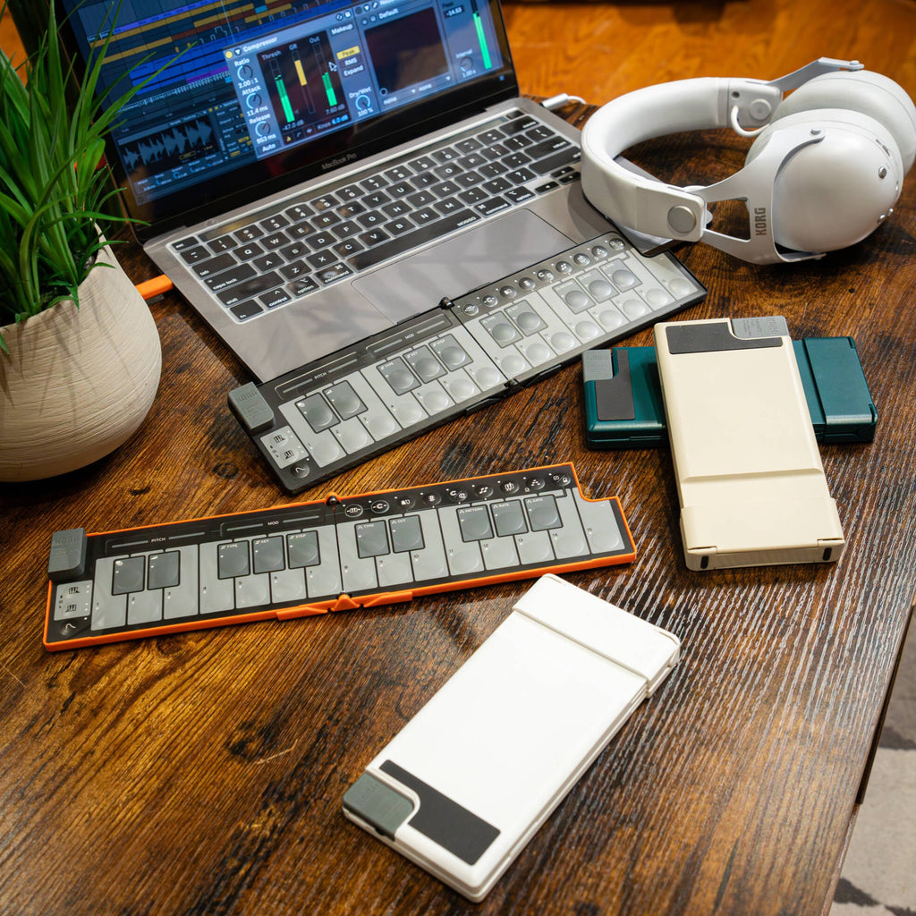 Black Korg nanoKEY Fold portable MIDI controller with keys, used as a sequencer and music production tool.