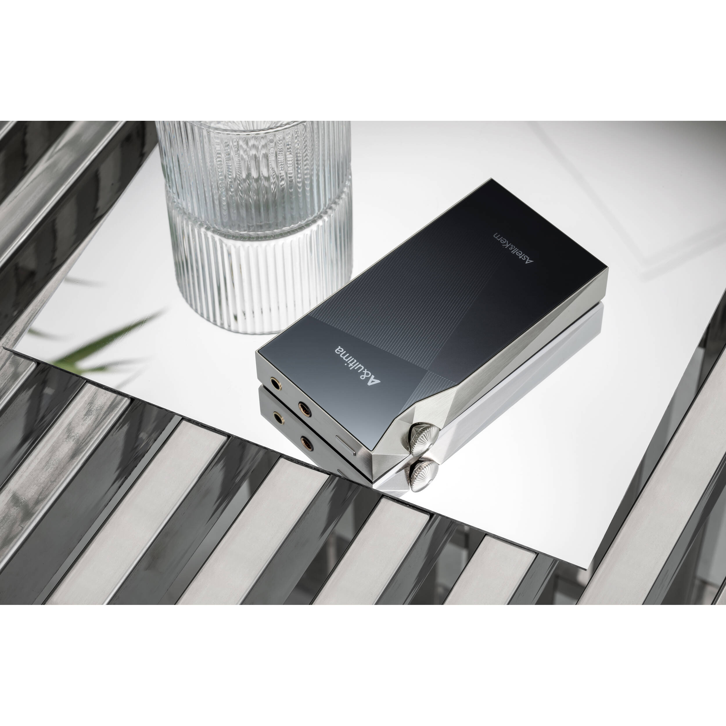 Astell&Kern A&ultima SP3000M portable music player with sleek black design and digital display screen.