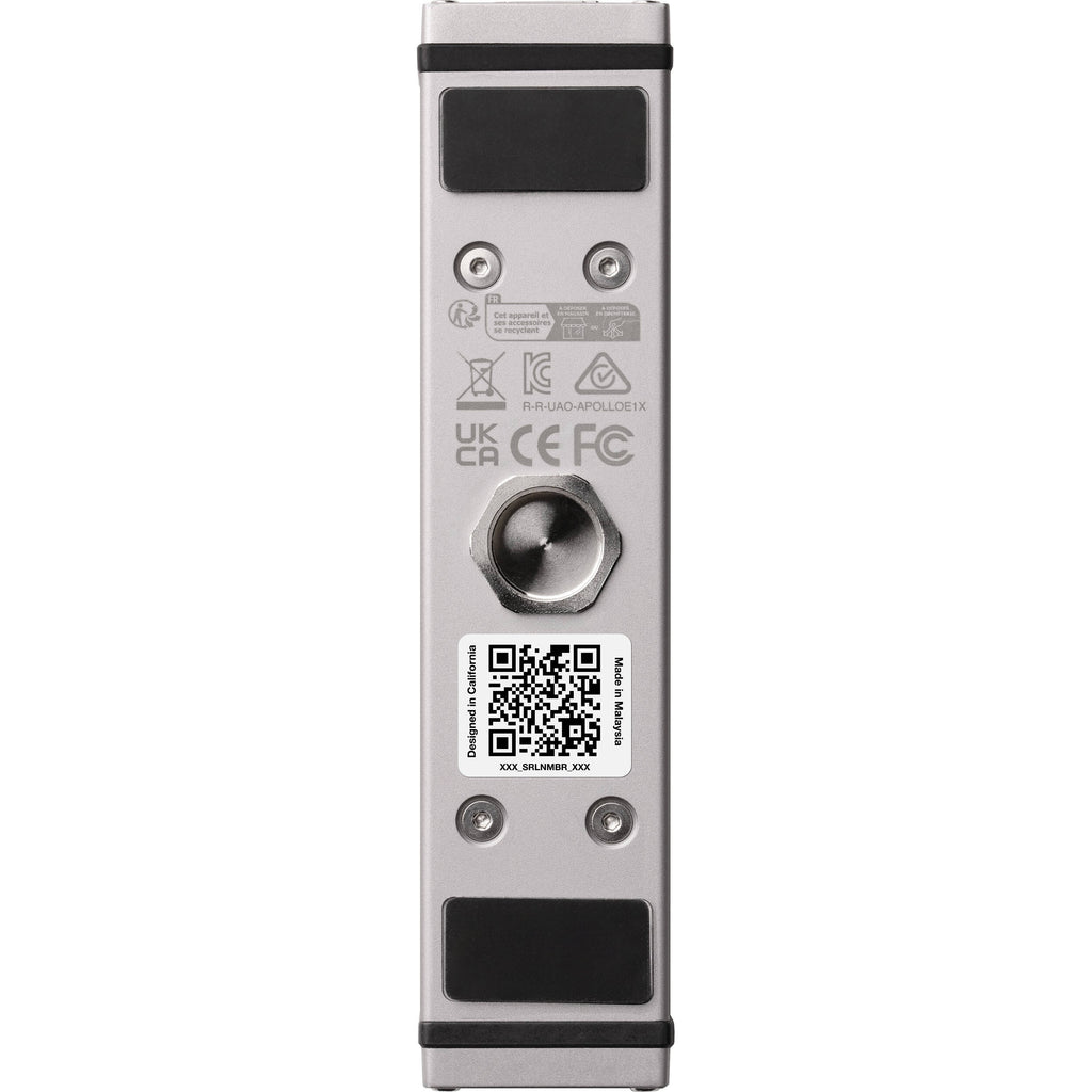 Universal Audio Apollo e1x microphone preamp with sleek design and multiple input options displayed on a wooden surface.