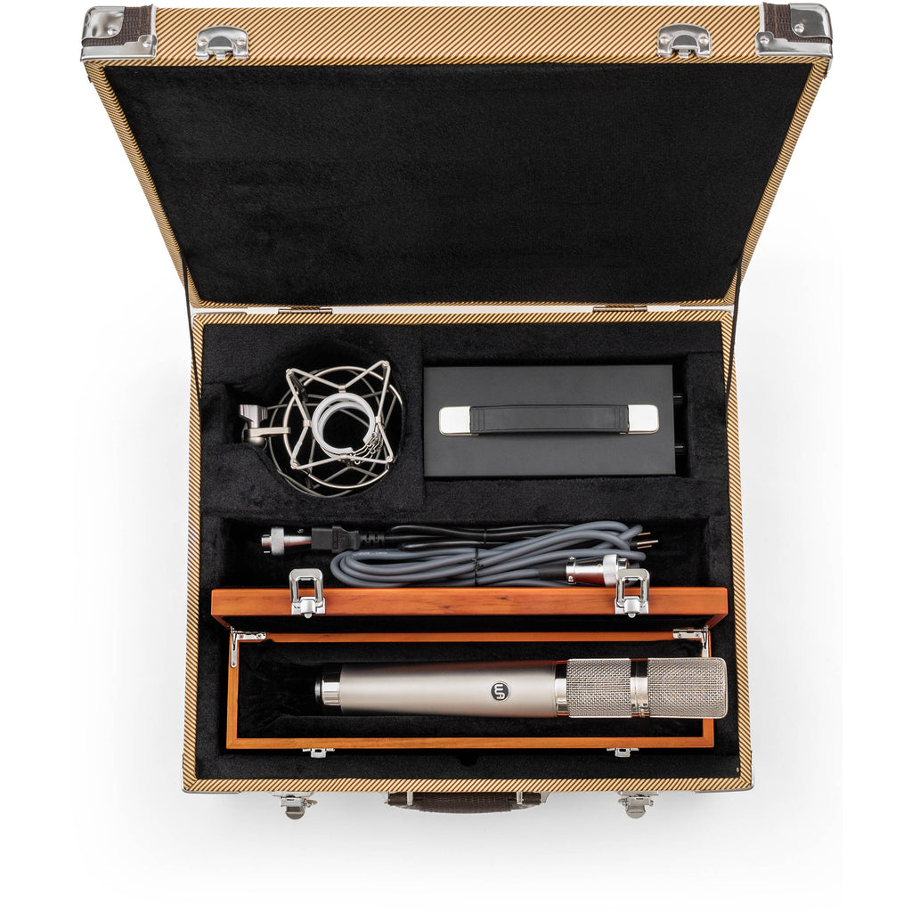 Warm Audio WA-CX24 condenser microphone shown with its black body and silver grille, designed for studio recording and vocals.