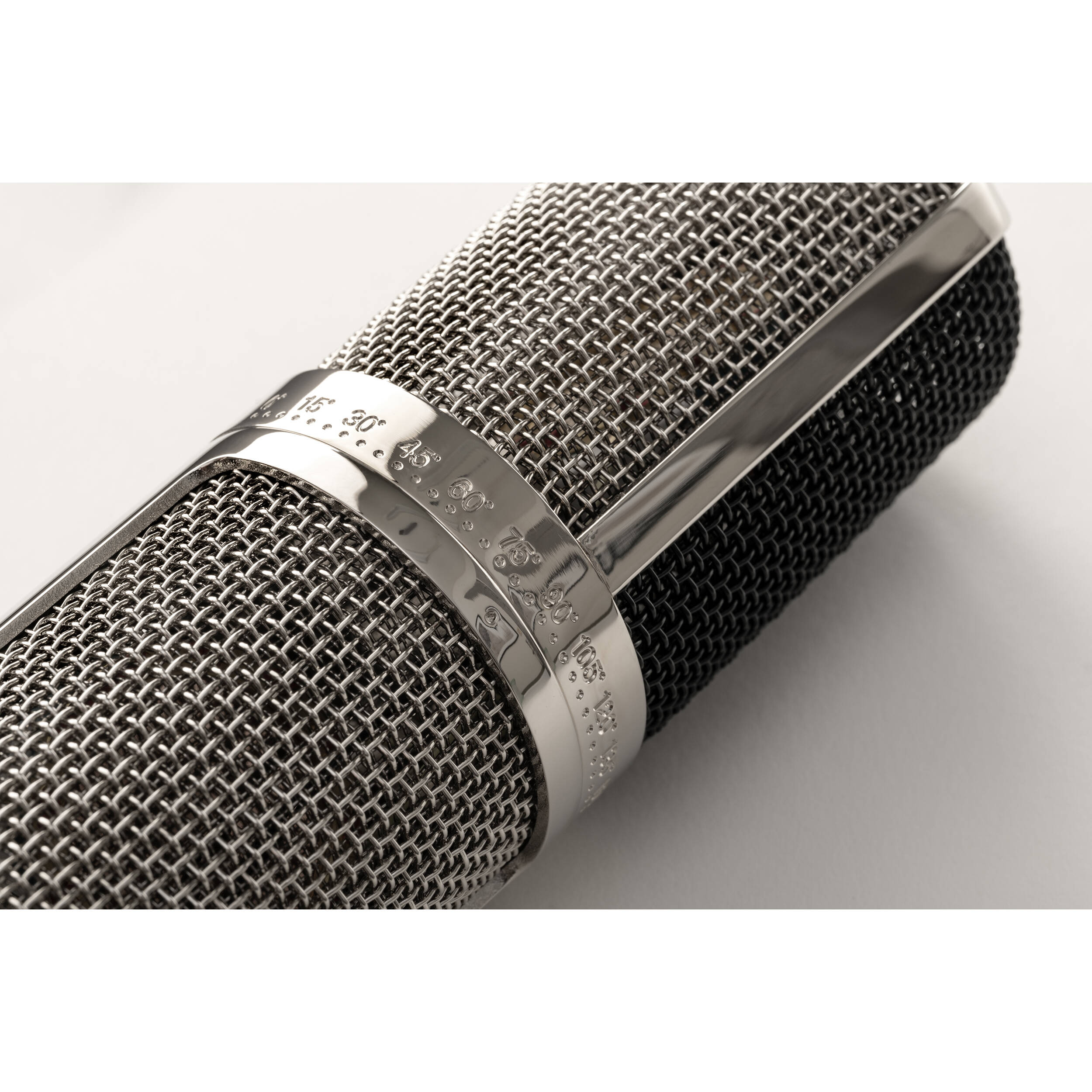 Warm Audio WA-CX24 condenser microphone with metal body and grille, suitable for studio recording and vocal capturing.