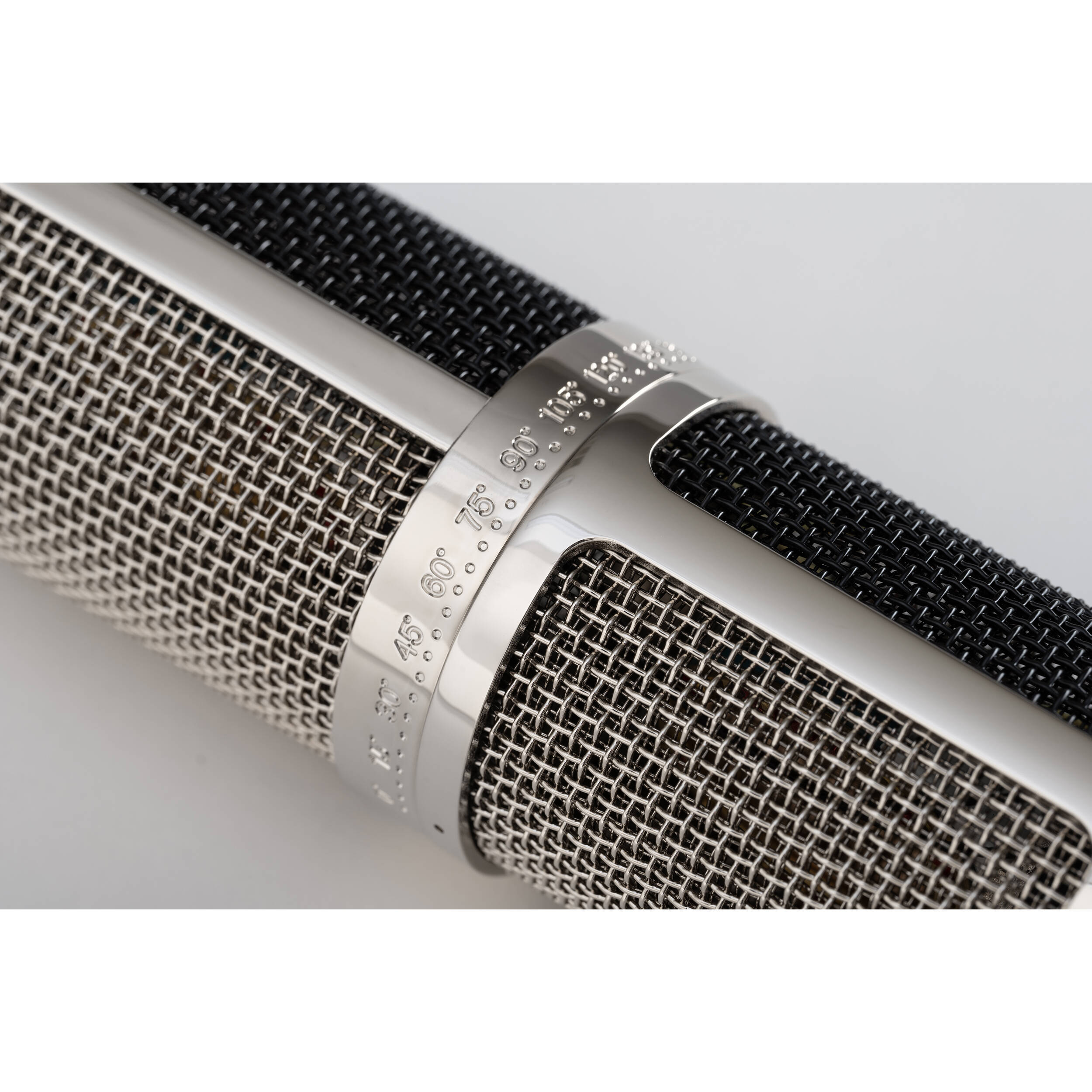 Warm Audio WA-CX24 condenser microphone with metal body and grille, suitable for studio recording and vocals.
