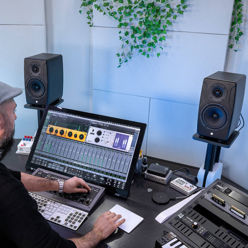 IK Multimedia iLoud Precision 6 MK2 active nearfield monitors shown with sleek black finish and front grille for studio sound.