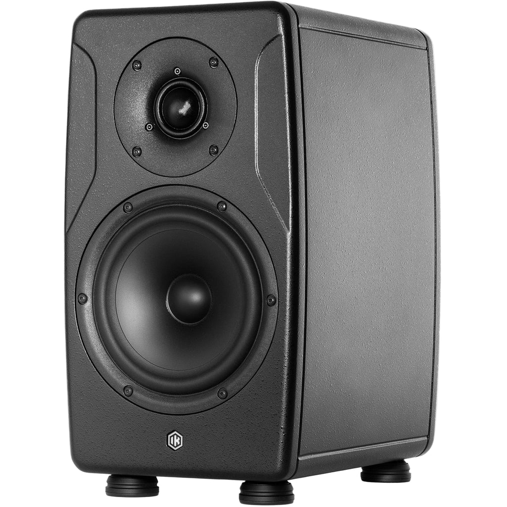 IK Multimedia iLoud Precision 6 MK2 active nearfield monitor speakers shown in a studio setting with a sleek black finish.