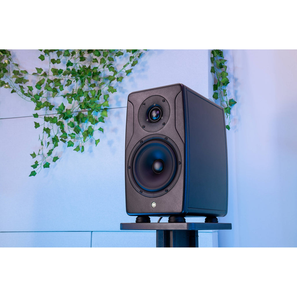 IK Multimedia iLoud Precision 6 MK2 active nearfield monitor showing a sleek black speaker with control knobs and a modern design.