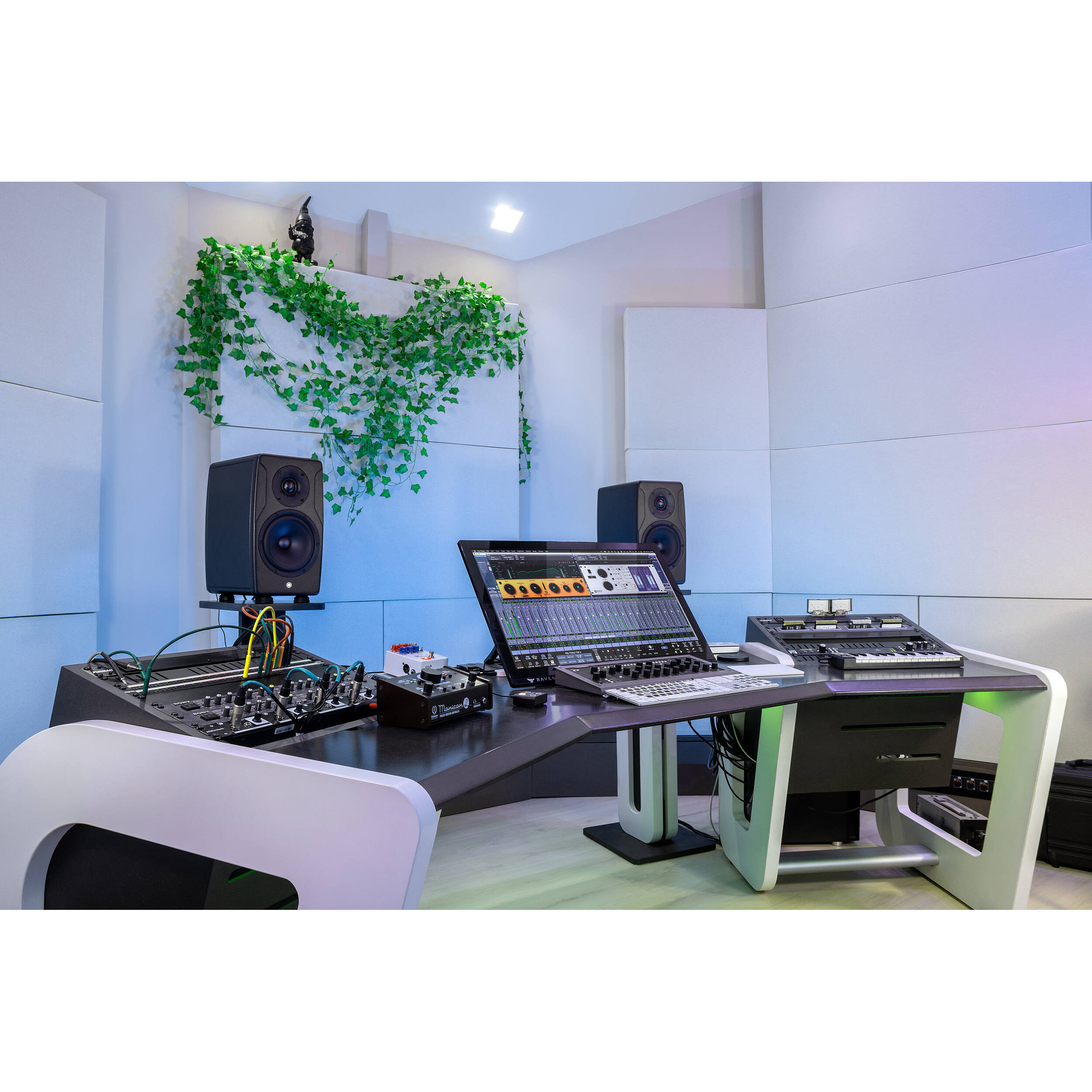 IK Multimedia iLoud Precision 6 MK2 active nearfield monitors showing black speaker cabinets with control panels.