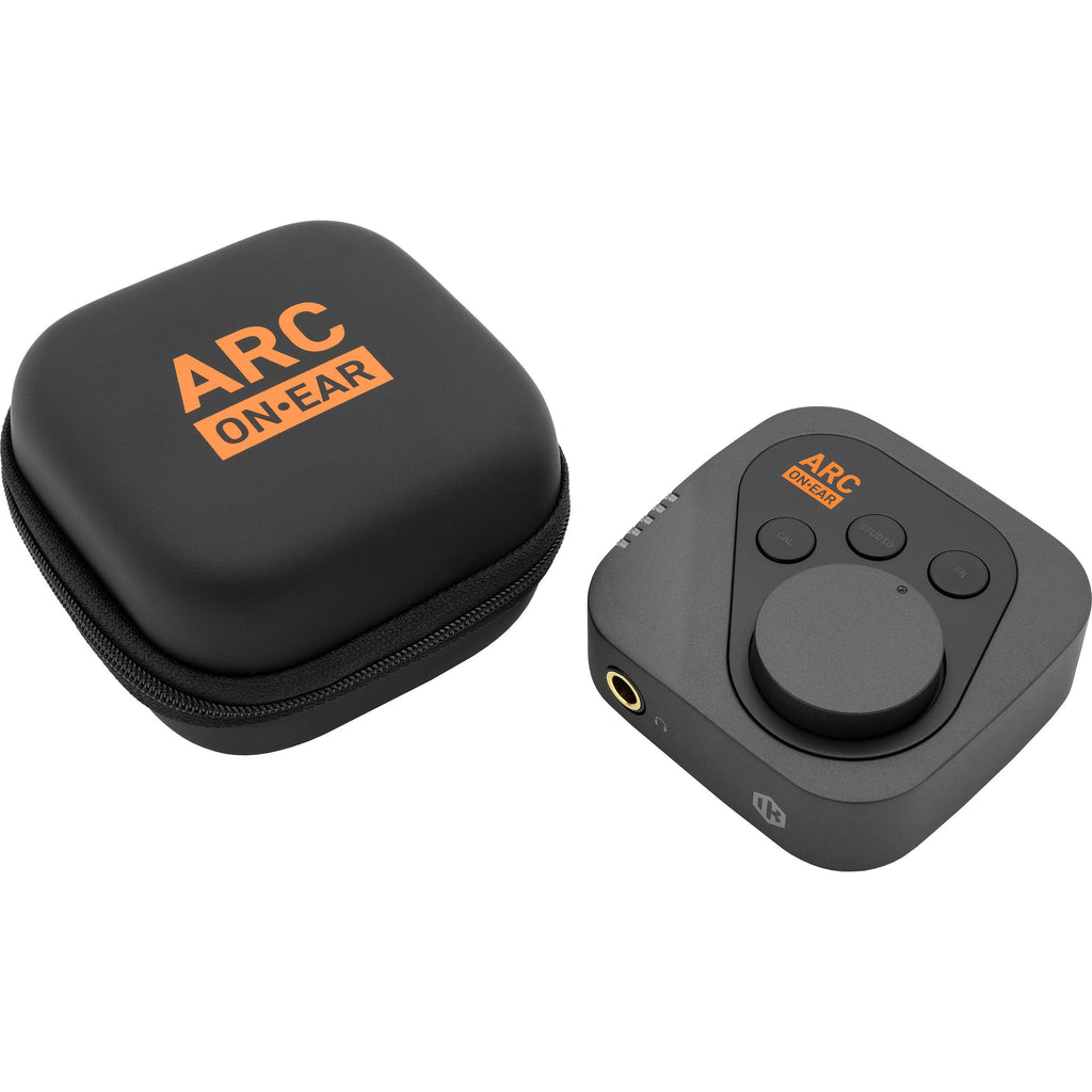 IK Multimedia ARC ON EAR headphone amplifier and DAC, black on-ear device with control buttons and connection ports.