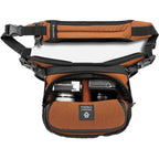 Wandrd Rogue Sling video equipment bag with adjustable strap and multiple compartments for camera gear storage.