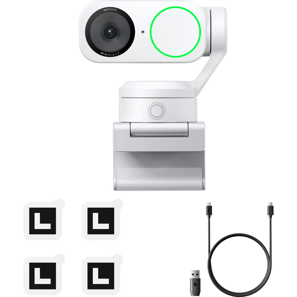 Insta360 Link 2 Standard video conferencing camera with adjustable lens and built-in microphone on a desk setup.