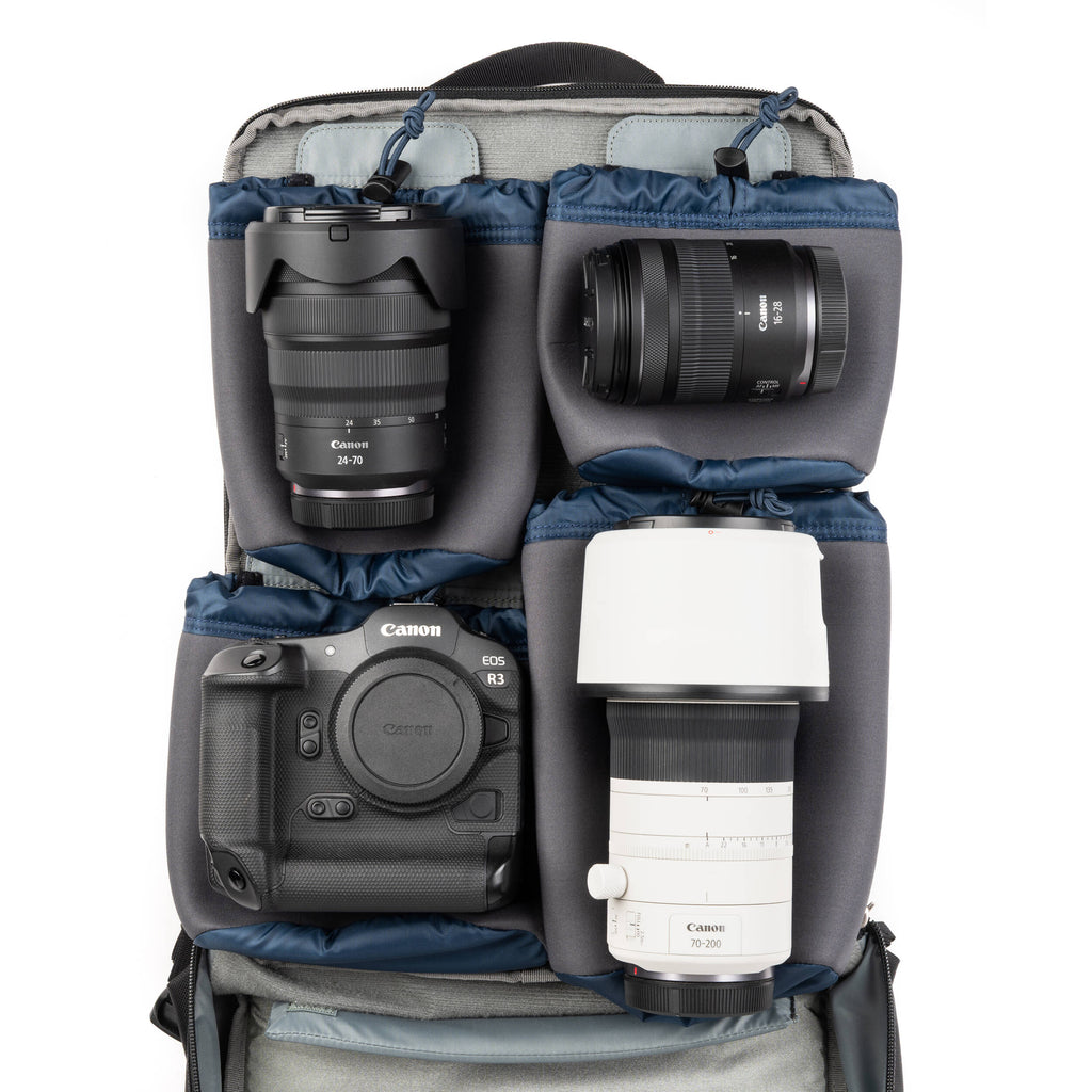 Think Tank Shape Shifter video equipment bag with multiple compartments and padded interior for camera gear storage.