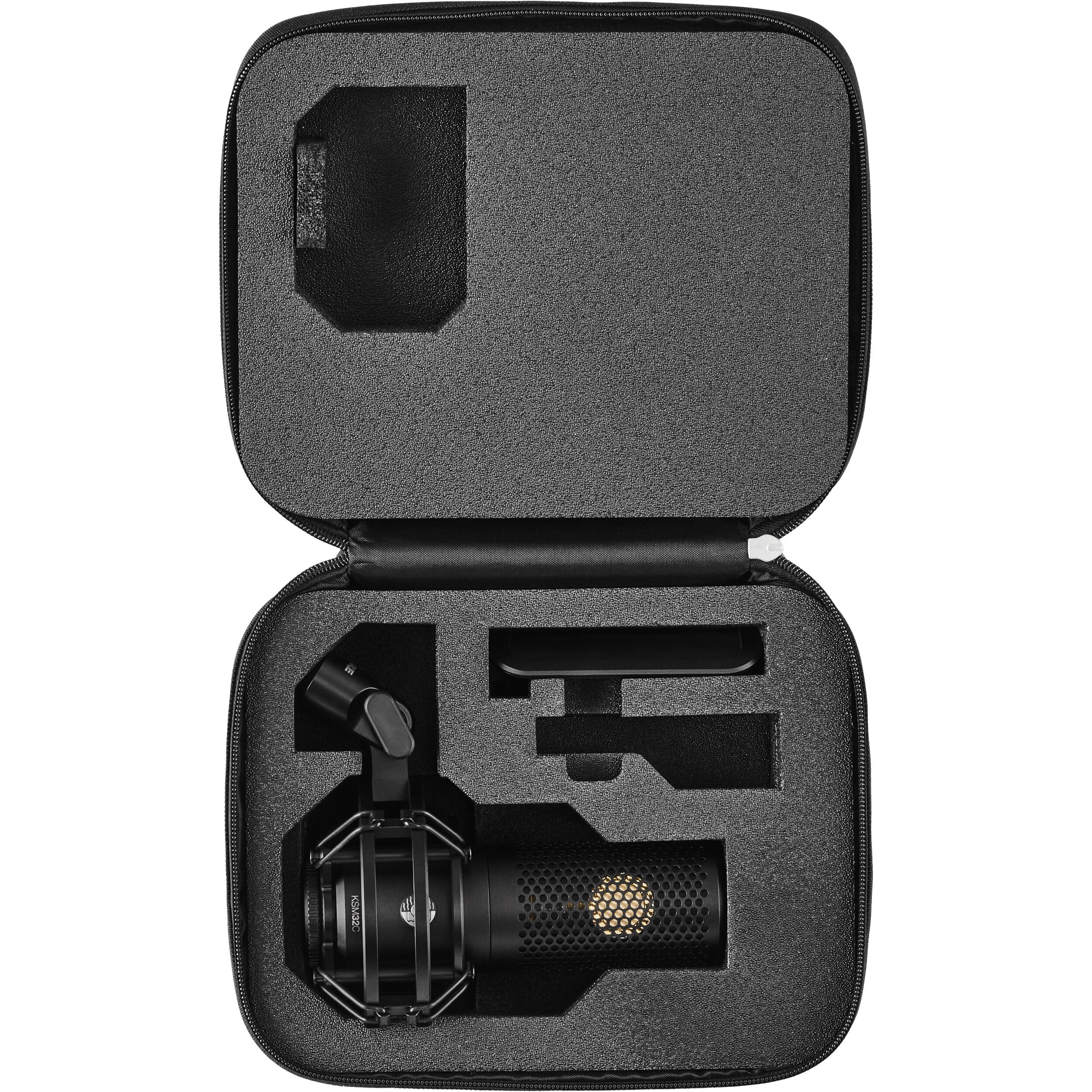Shure KSM32C/SM studio condenser microphone with shock mount and accessories, ideal for professional audio recording.