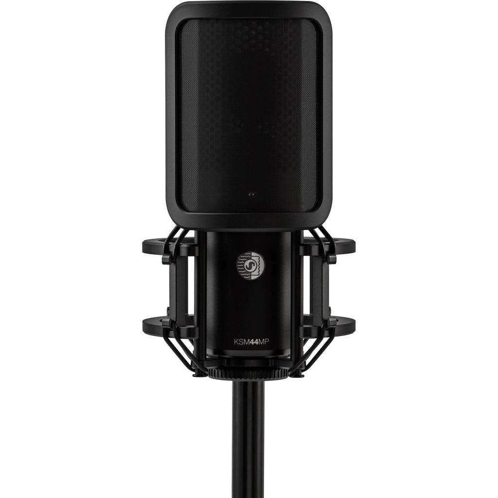 Shure KSM44MP condenser microphone with dual pattern capsules, black finish, and professional audio recording setup.