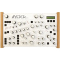 Modor NF-1 desktop synthesizer with knobs, buttons, and a small display, shown from a front view.