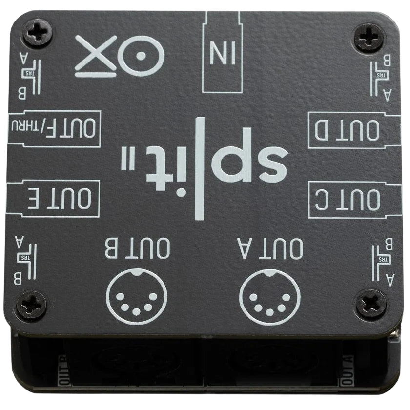 OXI Instruments Split 2 MIDI interface showing input and output ports on a sleek black device for music production.