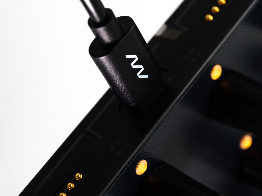 Close-up of Intech Studio EN16 Detent Series 3 MIDI controller with knobs and buttons on a sleek black surface.