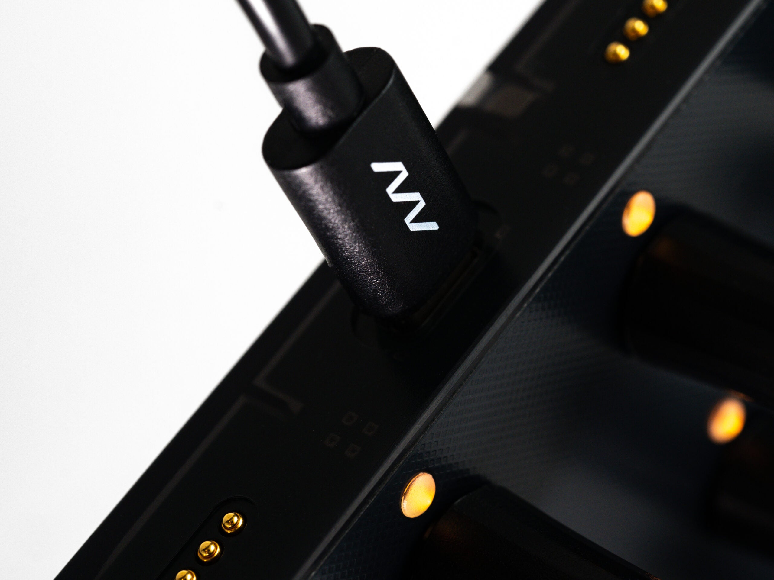Close-up of Intech Studio EN16 Detent Series 3 MIDI controller with knobs and buttons on a sleek black surface.