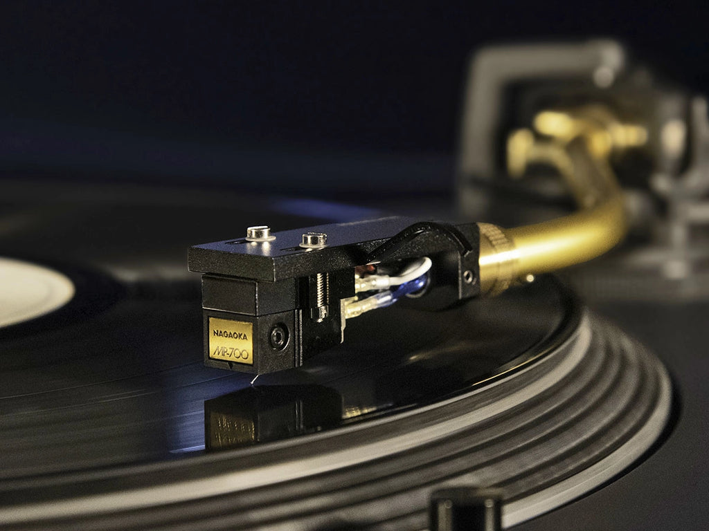 Nagaoka JN-P700 stylus installed on turntable cartridge playing vinyl record, close-up view of the stylus tip and cartridge.