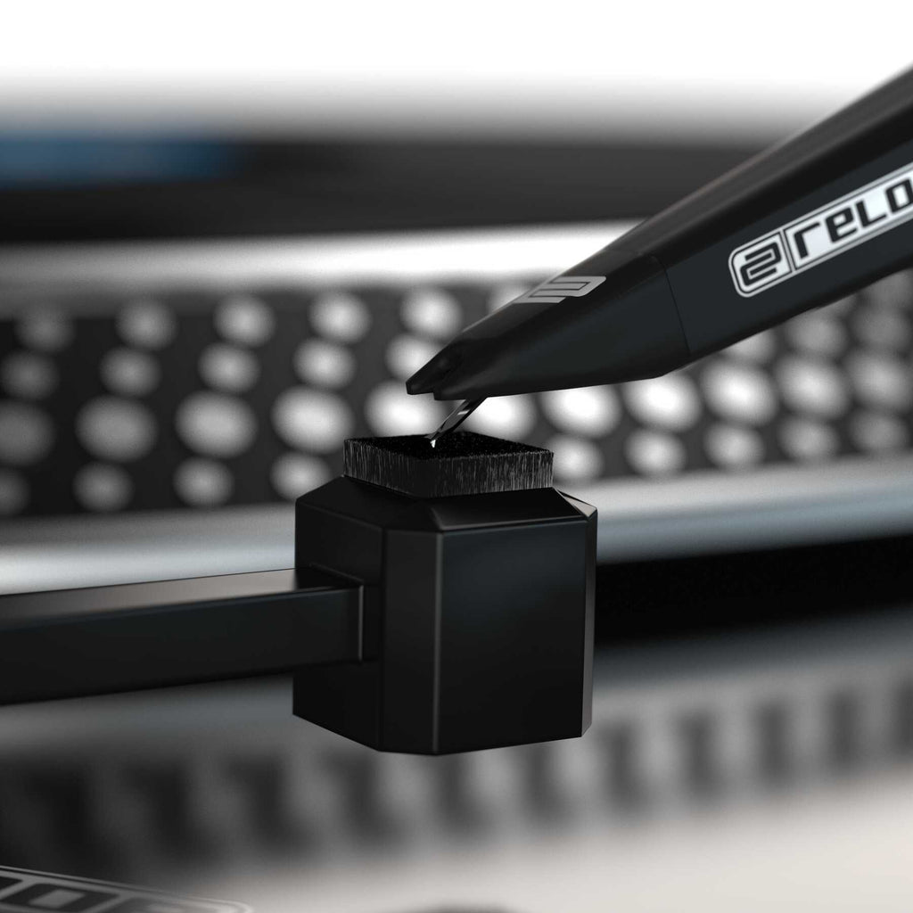 Reloop Premium Stylus Brush for record cleaning, featuring soft bristles to safely remove dust from turntable stylus.