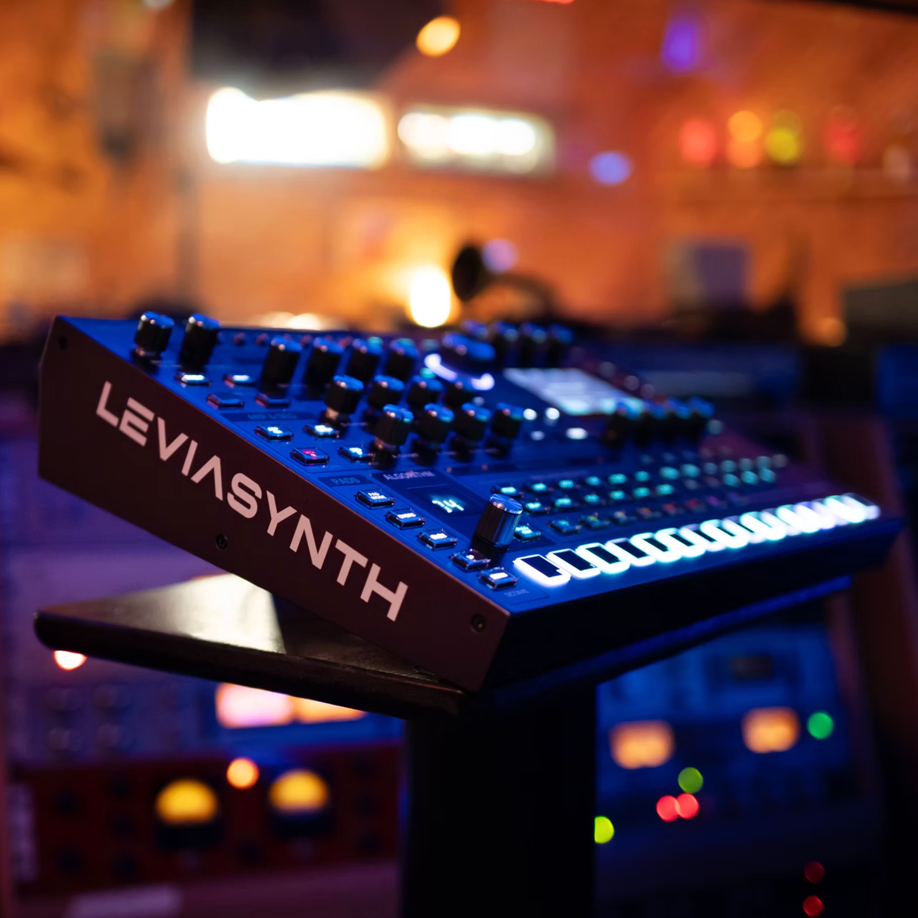 ASM Leviasynth Desktop synthesizer with tactile knobs, colorful controls, and compact design for music production.