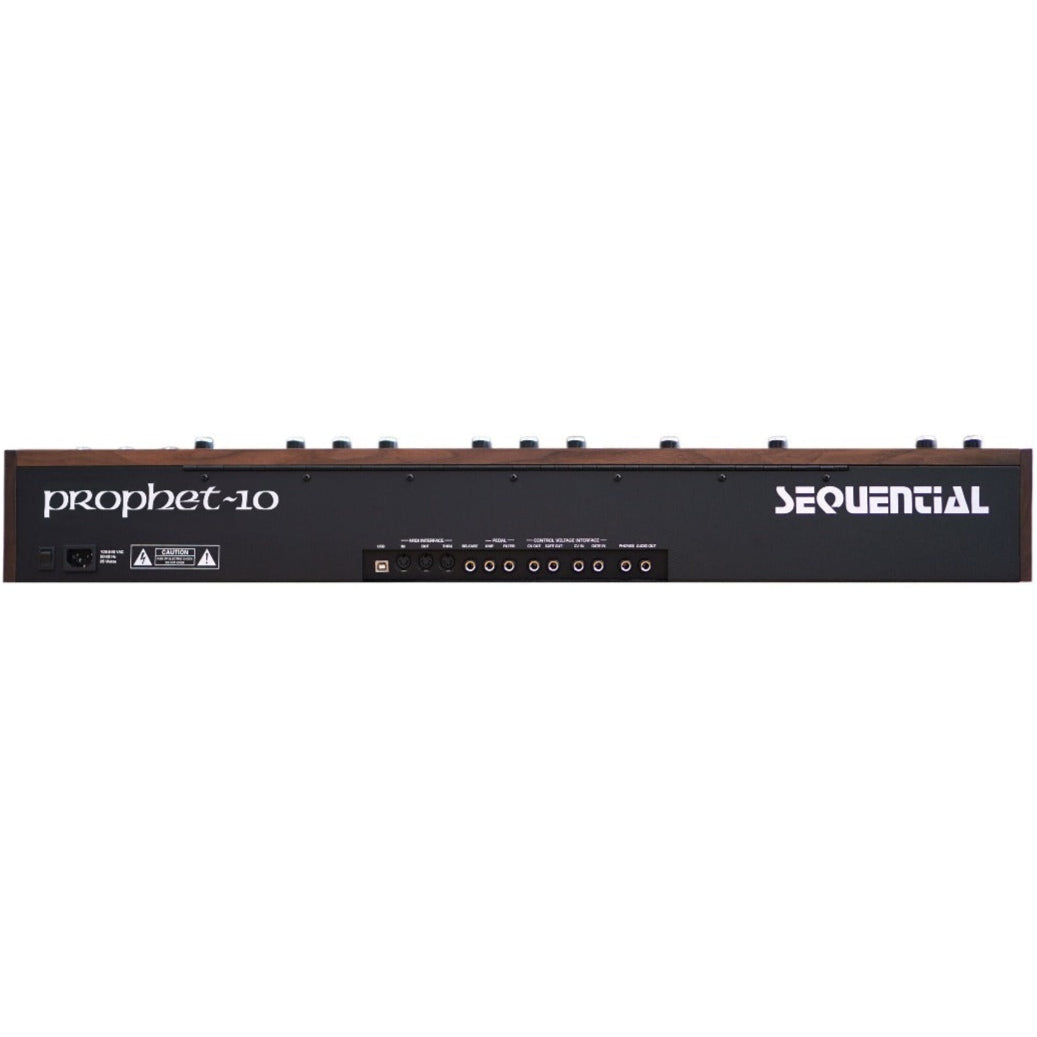 Sequential Prophet-10 synthesizer back panel with control knobs, inputs, and outputs on a black metal surface.
