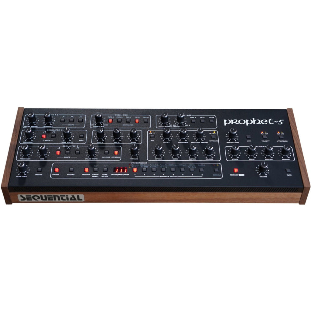 Sequential Prophet-5 Desktop synthesizer front angle view showing keyboard, control panel, and vintage electronic interface.