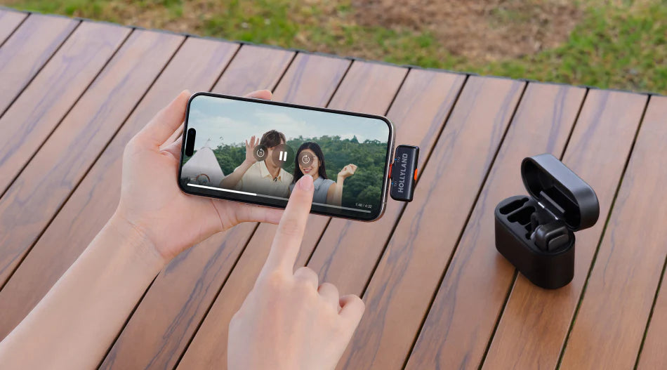 Hollyland Lark M2S Ultimate Combo wireless microphone system with camera, USB-C, and Lightning connectors, close-up detail.