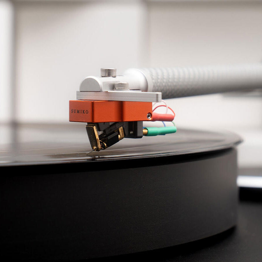 Sumiko Oriole MC phono cartridge mounted on turntable tonearm, showcasing detailed stylus and body design.