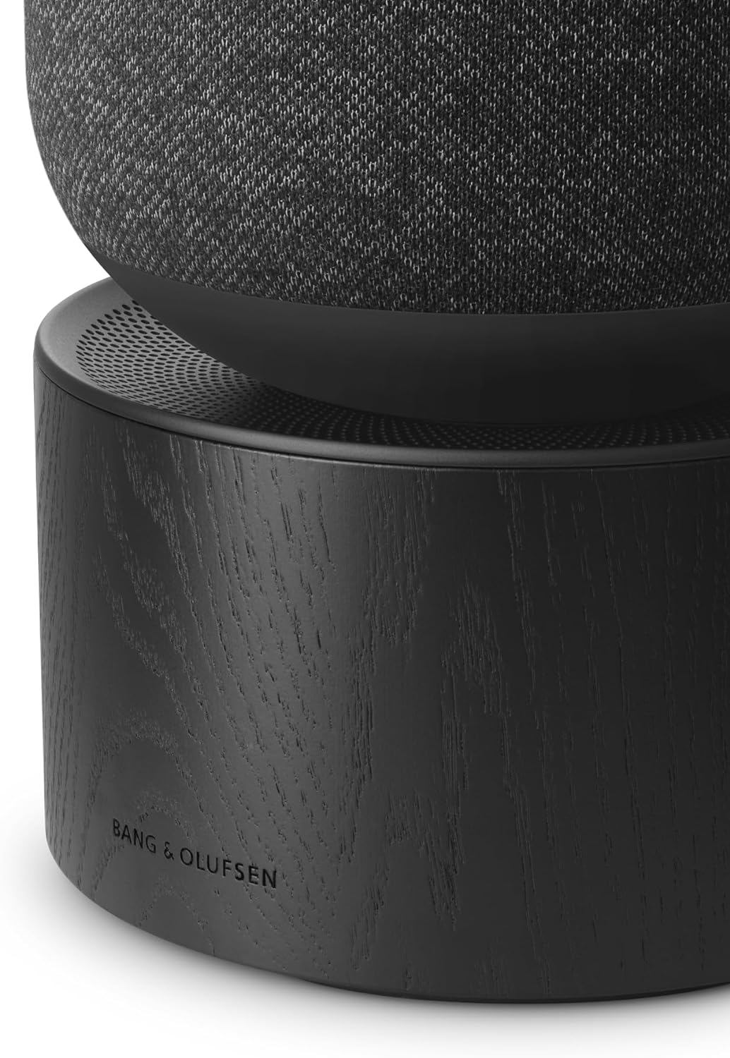 Bang & Olufsen Beosound Balance wireless speaker with sleek modern design and fabric covering, showcasing its premium audio setup.