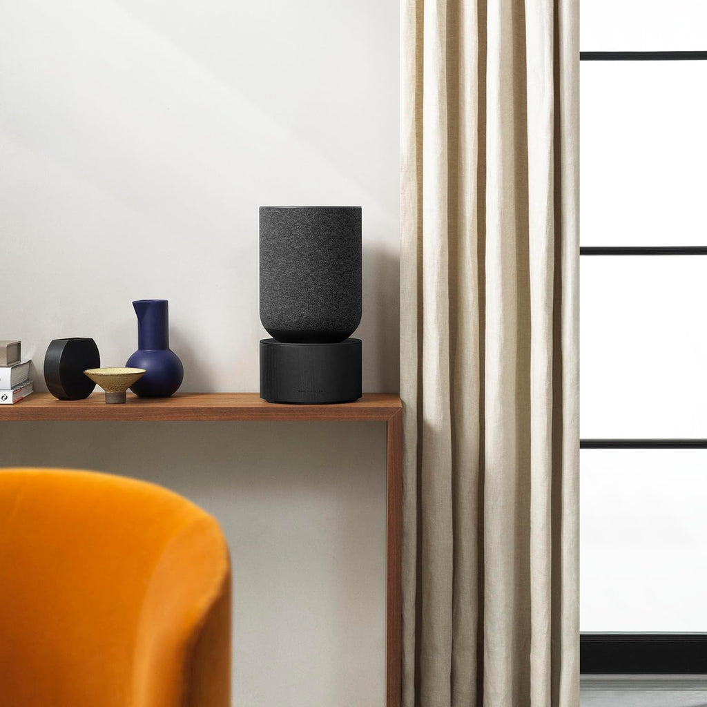 Bang & Olufsen Beosound Balance wireless speaker with sleek modern design and fabric-covered speaker grille.