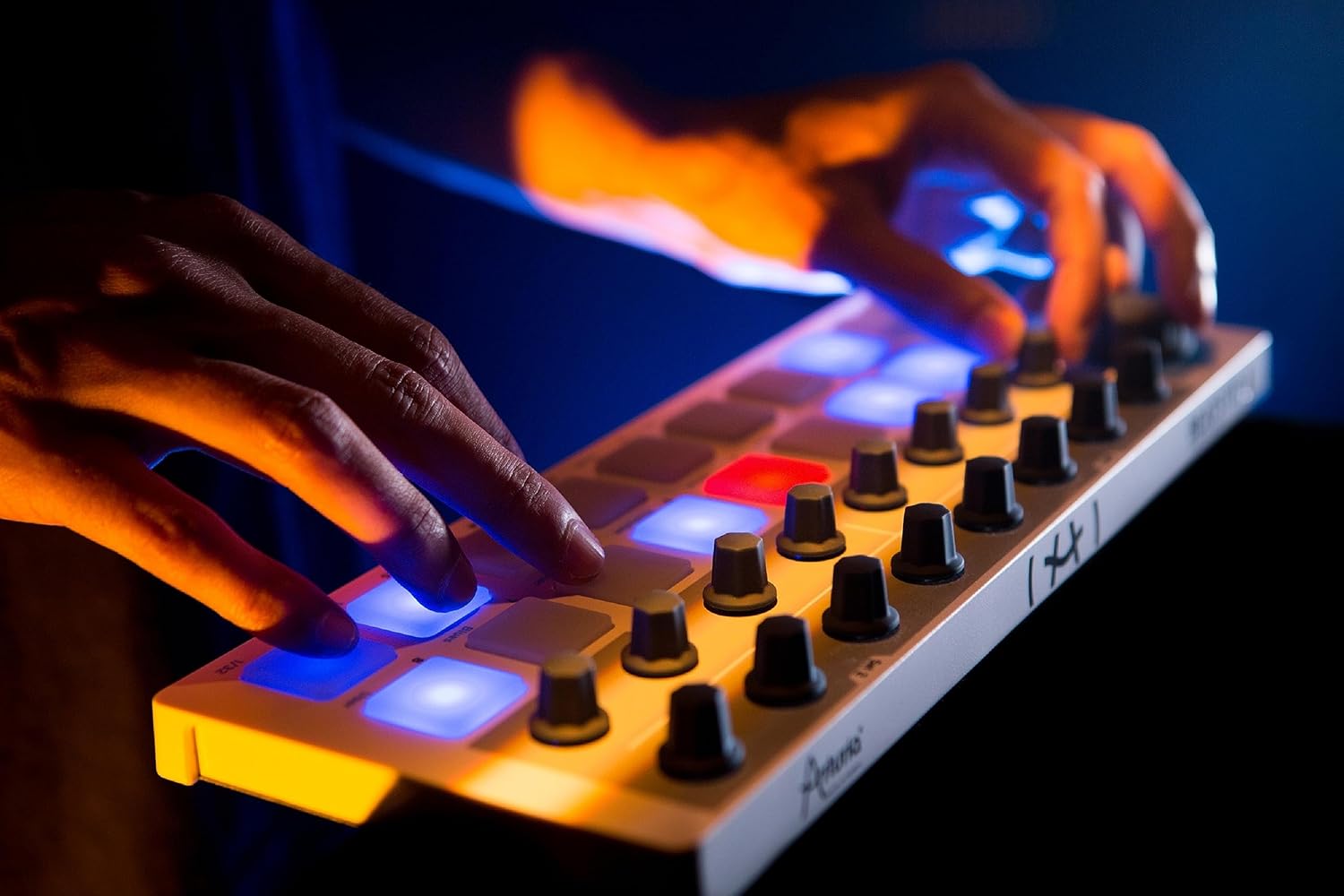 Arturia BeatStep sequencer with control pads and knobs on a black compact device, used for music production and live performance.