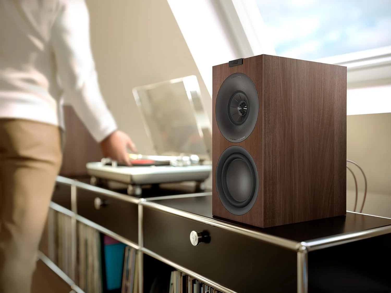 KEF Q Concerto Meta passive bookshelf speakers with sleek black cabinets and front-facing drivers for high-quality audio.