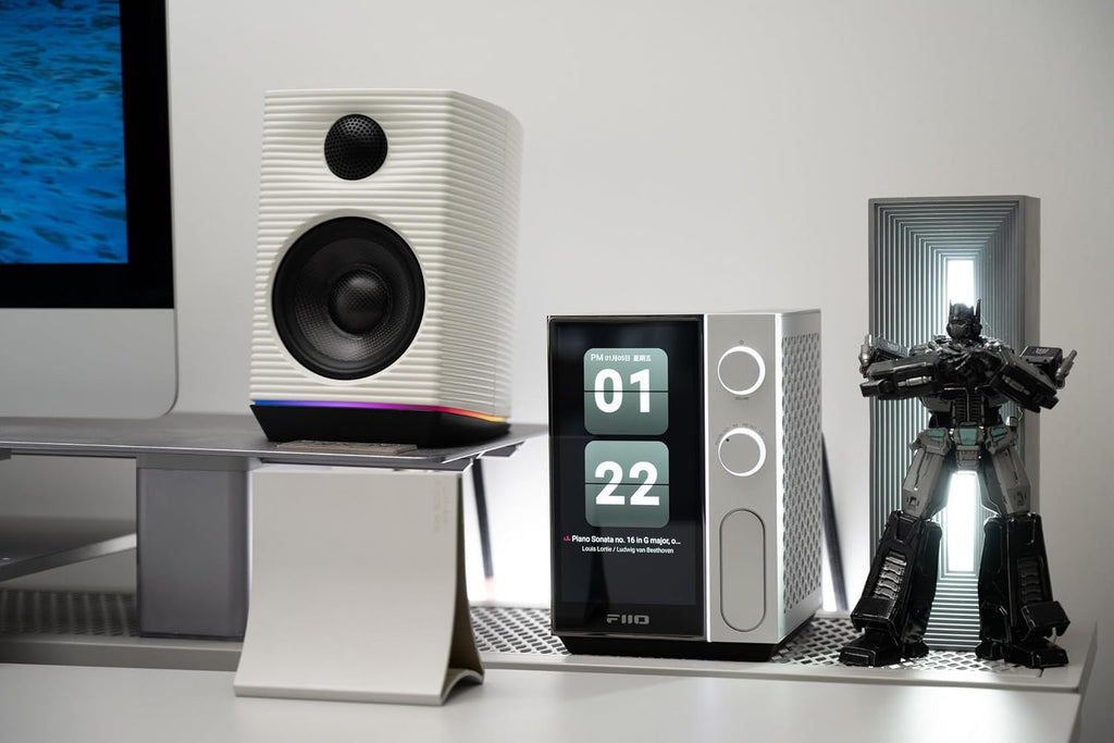 FiiO R9 music streamer device with black finish, featuring multiple input ports and a sleek modern design.