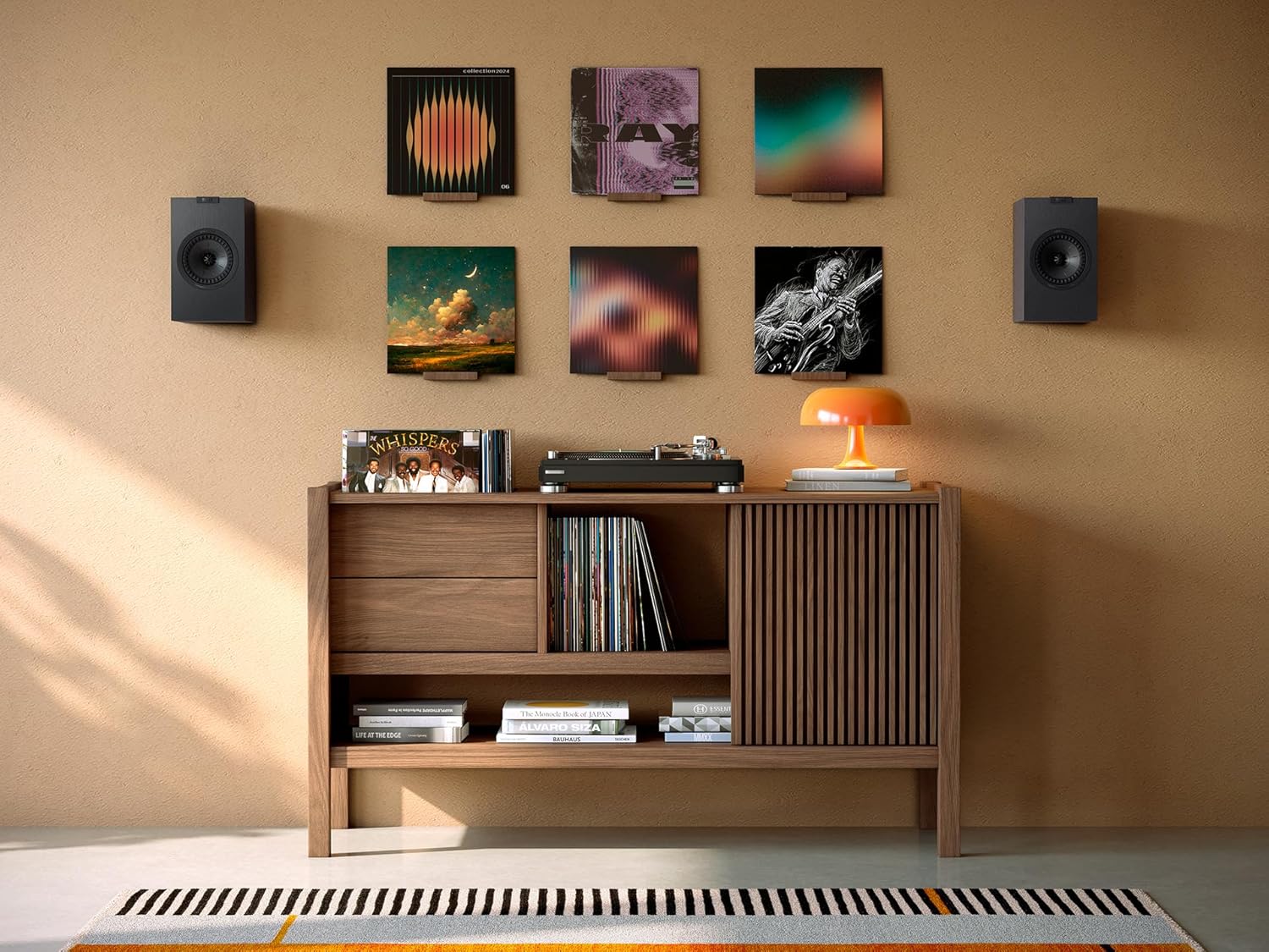 KEF Q1 Meta passive bookshelf speakers with black finish, compact design, and detailed speaker grille for high-quality sound.