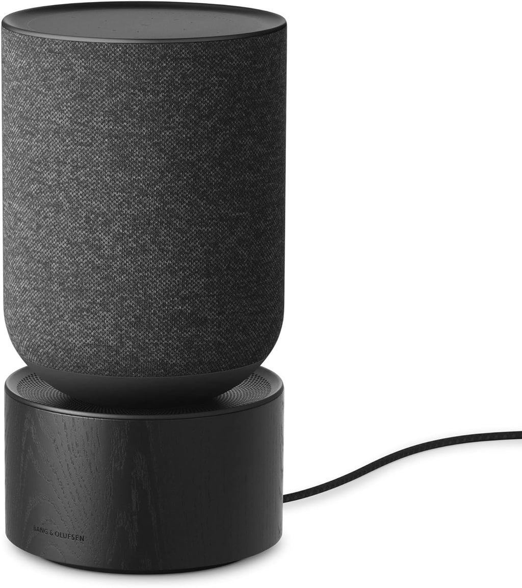 Bang & Olufsen Beosound Balance wireless speaker with sleek cylindrical design and premium wooden finish.