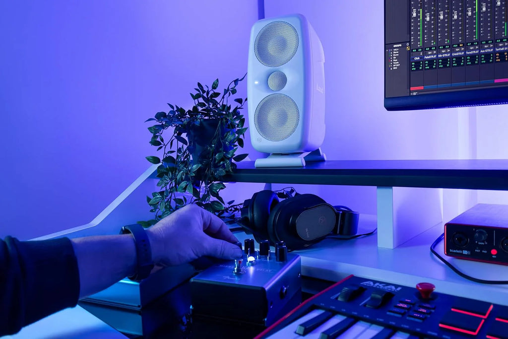IK Multimedia iLoud MTM MK2 active nearfield monitors shown with front and side views, compact design, and control panel.