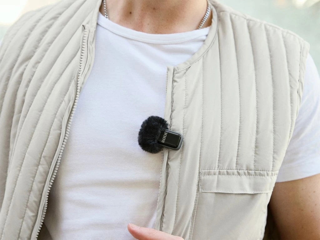 Rode Wireless Micro Lightning wireless microphone system in black, compact design for high-quality audio recording.
