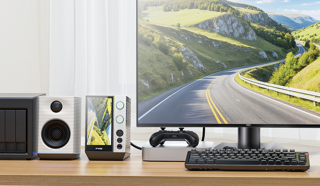 FiiO R9 music streamer with sleek black design, featuring multiple input ports and a digital display on a modern audio device.