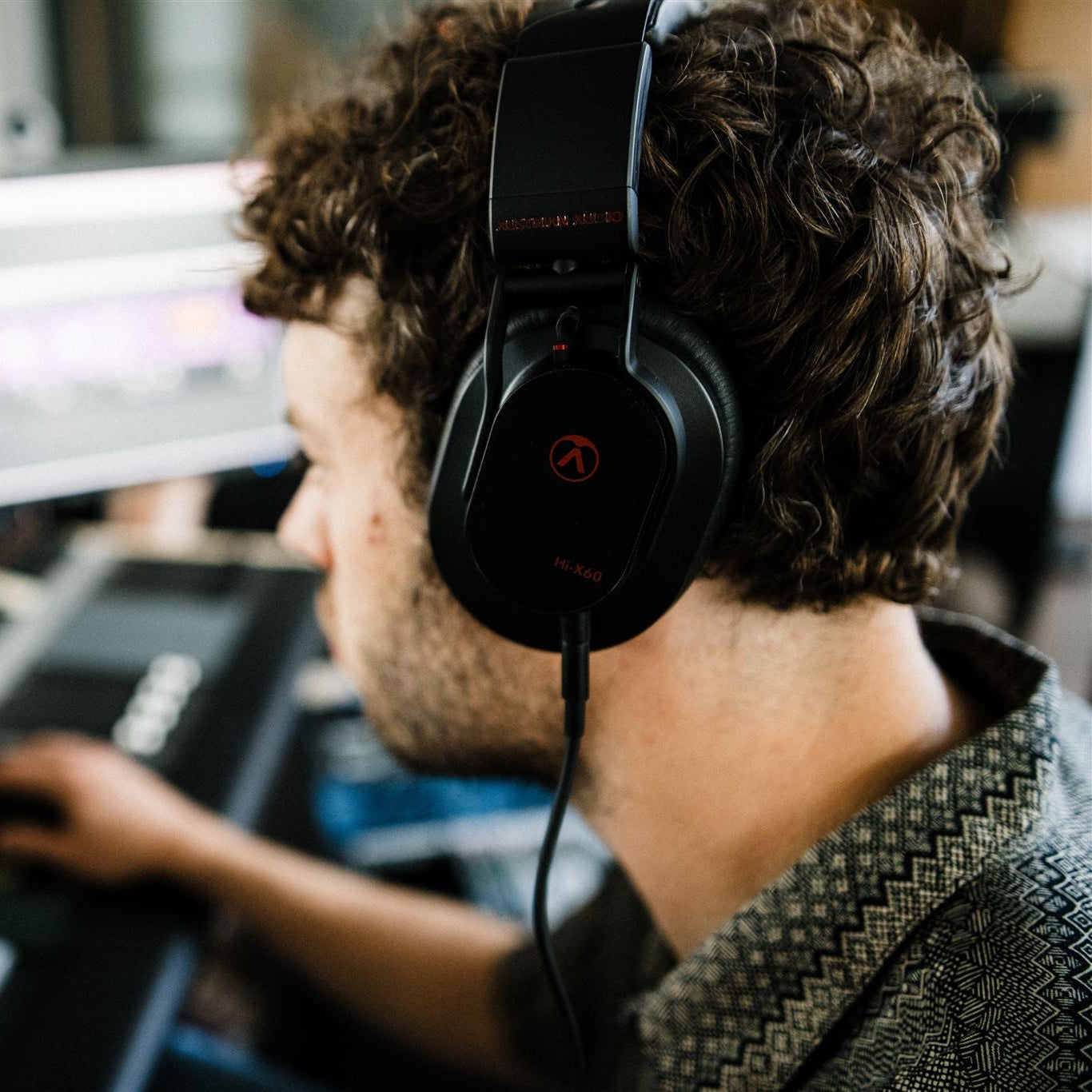Austrian Audio Hi-X60 studio headphones with over-ear design, black finish, and padded ear cups for professional audio monitoring.