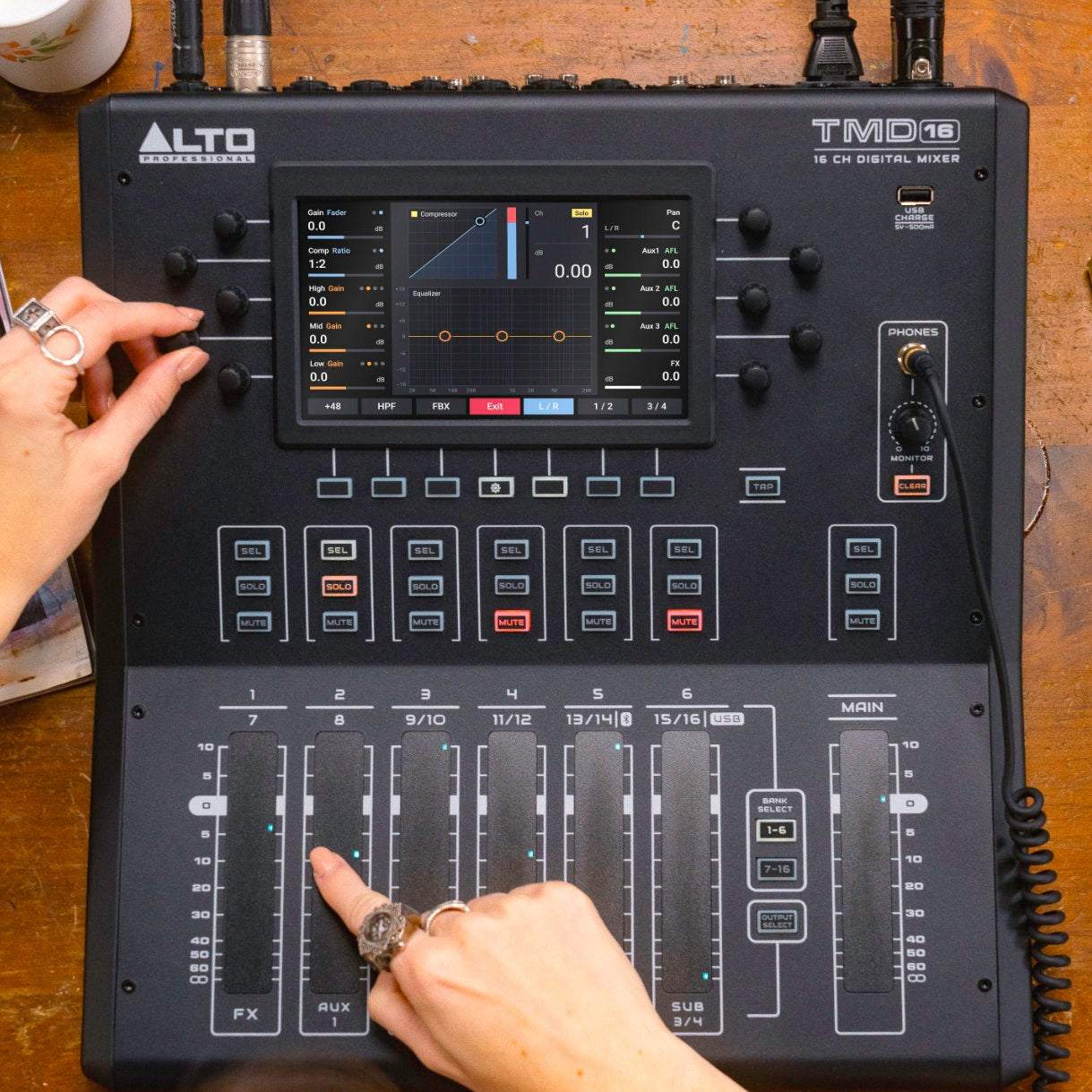 Front view of Alto Professional TMD16 digital mixer with multiple input channels and control knobs.