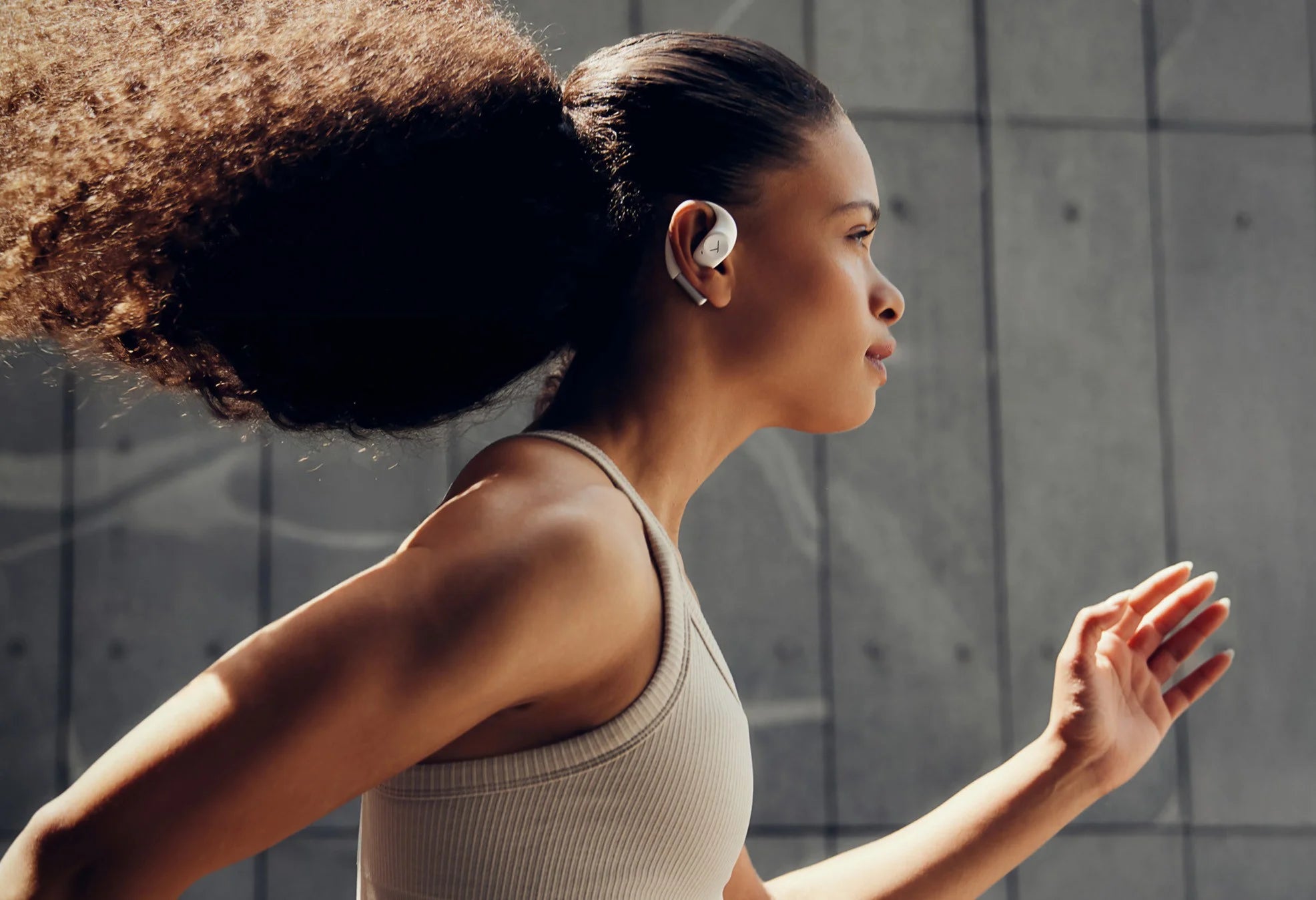 Beyerdynamic Amiron 200 wireless in-ear headphones with open design and sleek black finish, shown in a close-up image.